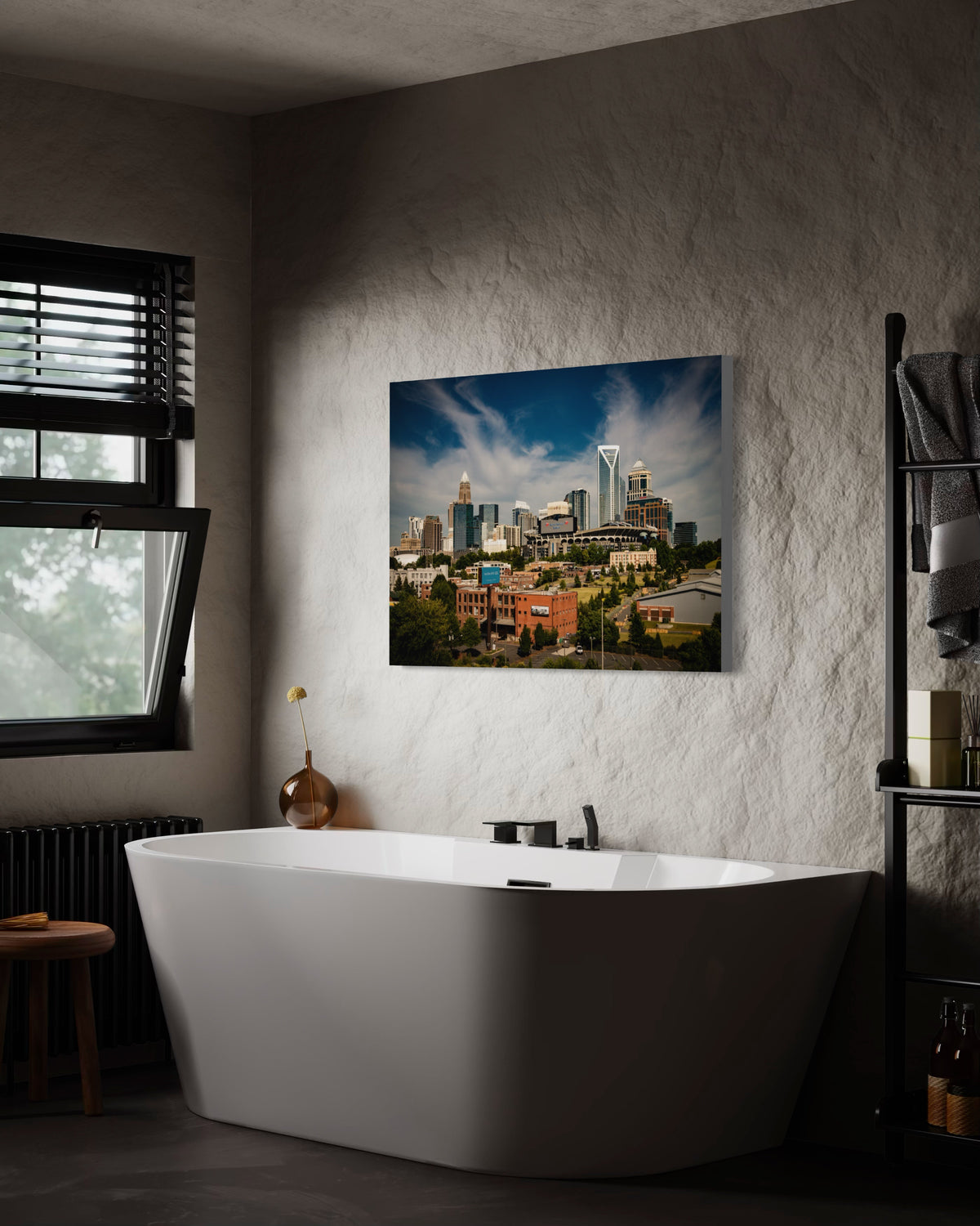 Charlotte skyline print on a textured wall above a freestanding bathtub