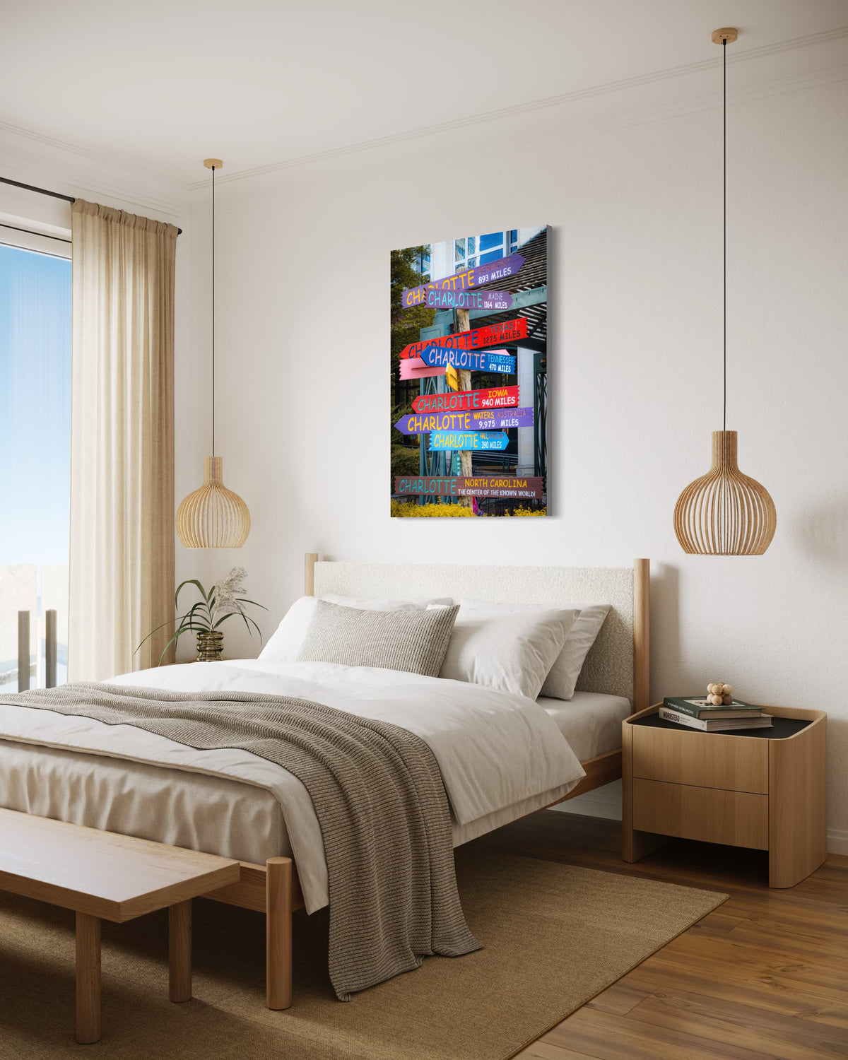 Directions print above a bed with a white upholstered headboard and oak frame, between two wooden pendant lamps