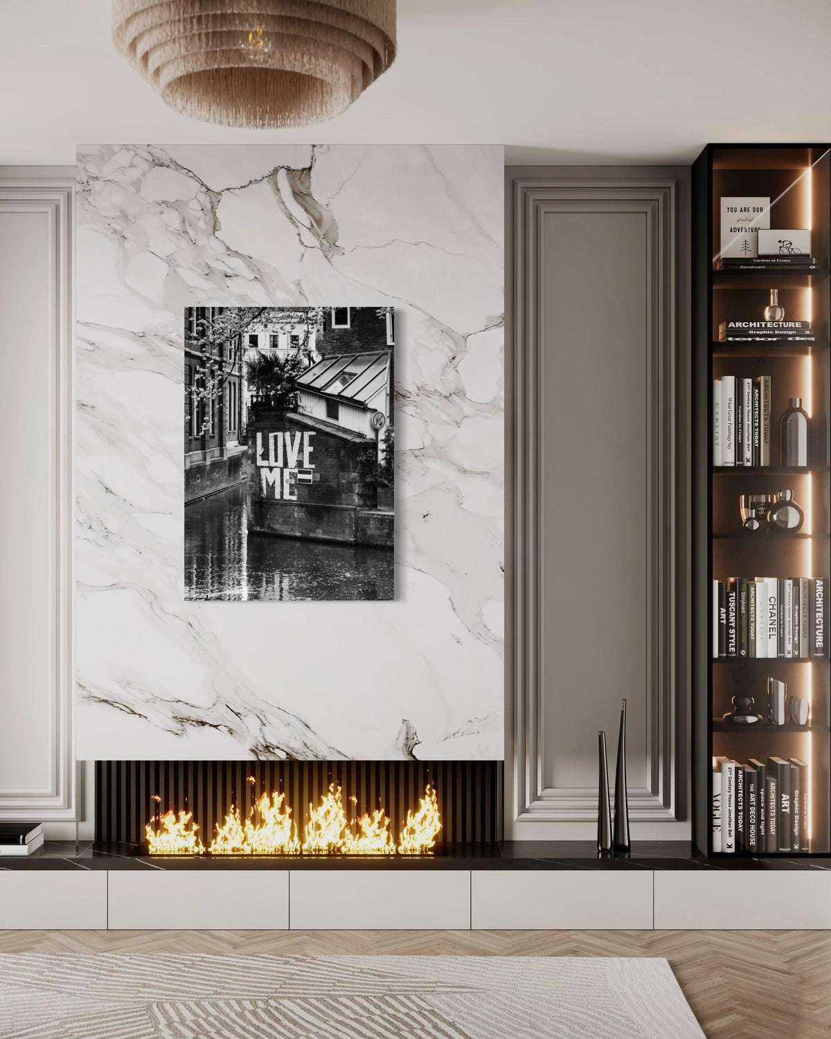 Love Me print on a white marble wall above a modern fireplace, next to lit bookshelves